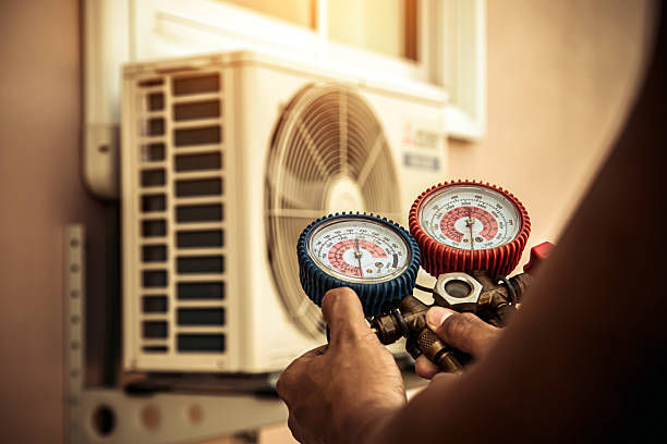 Professional Air Conditioning Service technician working in Cascade, CO